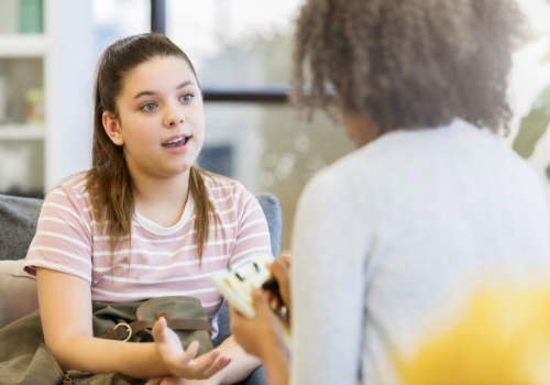 A woman discussing their week during Peoria Counseling Services