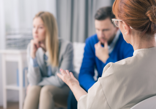 A therapist talking with an unhappy couple during Relationship Counseling in Dunlap IL
