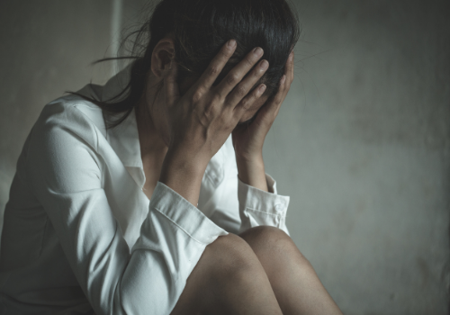 Woman struggling while going through Abuse and Trauma Recovery