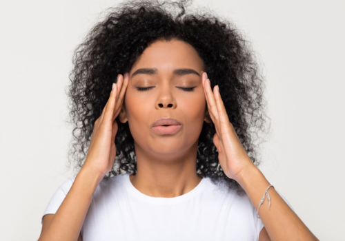 A woman trying to calm down from an anxiety attack