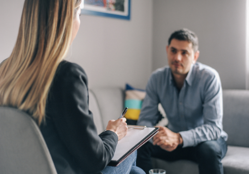 Substance Abuse and Addiction counselor talking with a patient