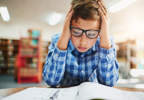 A young child having a difficult time focusing, needing ADHD Treatment in Peoria IL