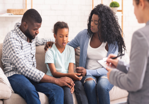 Parents sitting with child during Children and Teen Counseling in Peoria IL