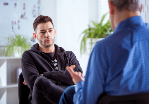 Man discussing anxieties with a counselor during Anxiety Therapy in Peoria IL