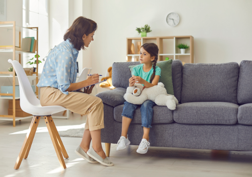 A counselor talking with a child during Parenting Allocation Evaluations in Peoria IL