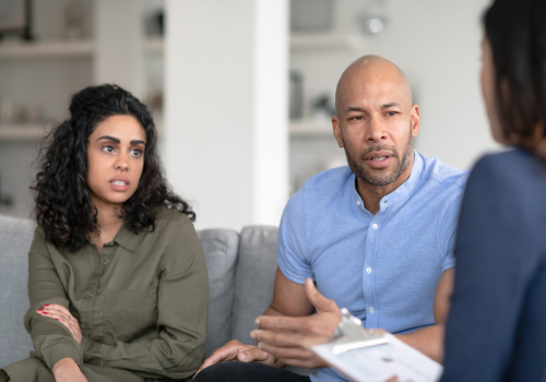 An unhappy couple discussing their relationship with Marriage Counselors in Washington IL