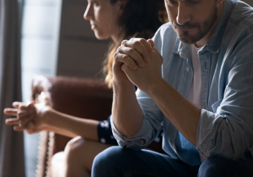 An unhappy couple discussing their relationship in relationship counseling near you
