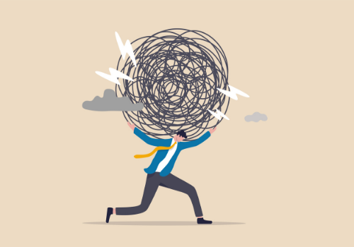 An illustration of a man with a ball of anxiety, needing Anxiety Therapy in Dunlap IL