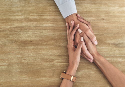 Counselor holding the hand of a client to give support during Depression Therapy in Peoria IL