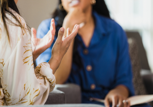 Woman discussing Assertiveness Training in Peoria IL with a counselor