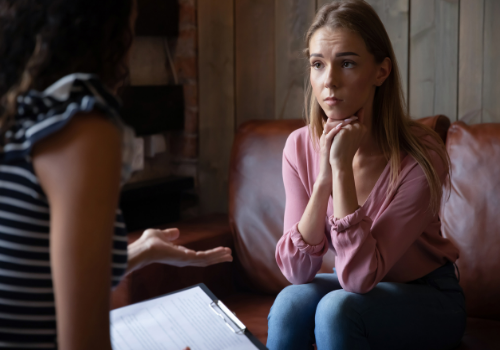 A concerned woman talking with a mental health professional during General Counseling in Dunlap IL
