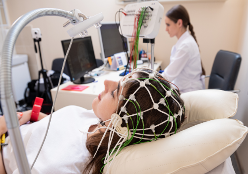A woman with sensors on her head, undergoing Neurofeedback Treatment in Dunlap IL