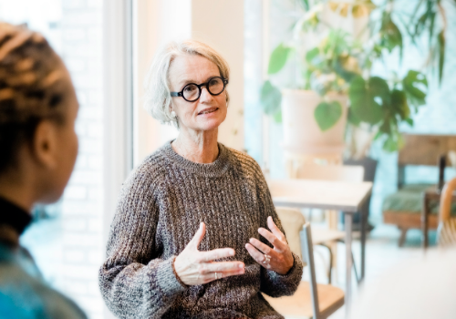 A counselor talking with a client during Psychotherapy in Peoria IL