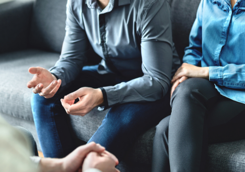 Unhappy couple speaking with a counselor during Divorce and Family Mediation in Peoria IL