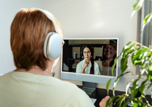 A woman talking with their counselor on their computer during Telehealth Therapy in East Peoria IL