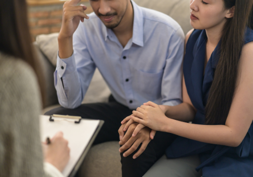 A couple talking with Marriage Counselors Near You