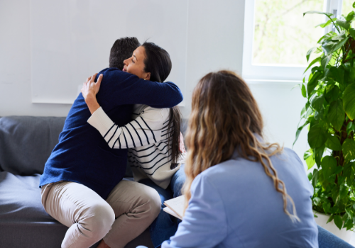 A happy couple hugging after a breakthrough with Marriage Counselors in Dunlap IL