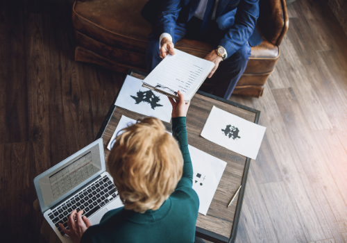 A person administering Psychological Testing to a client in Peoria IL