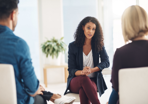 A therapist discussing issues in the home with a couple during Relationship Therapy in Peoria IL