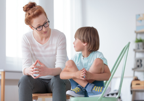 A child with Autism Spectrum Disorders working with a counselor in Peoria IL
