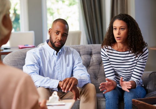 An unhappy couple talking during Couples Counseling Near You