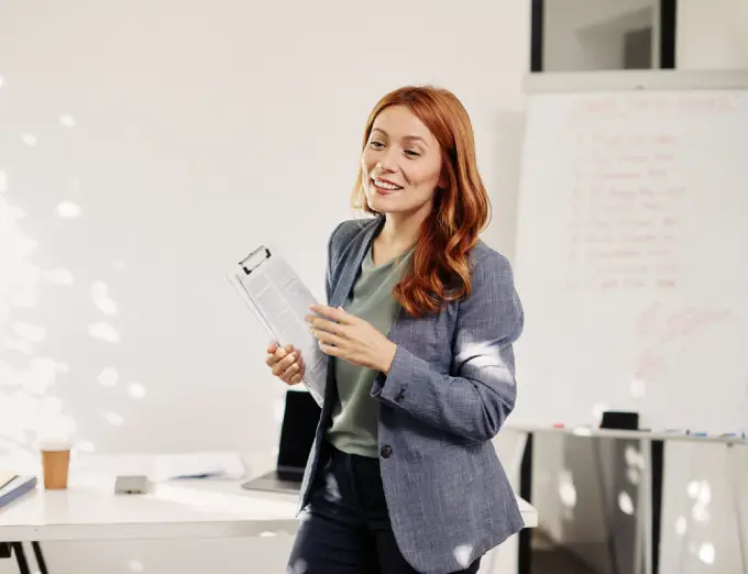 A female presenter discussing how to navigate a career change, part of the life coaching and personal coaching services offered by Chapin & Russell Associates.