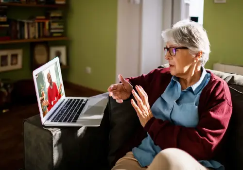 An elderly person in session, talking with there therapist during Peoria Telehealth Therapy